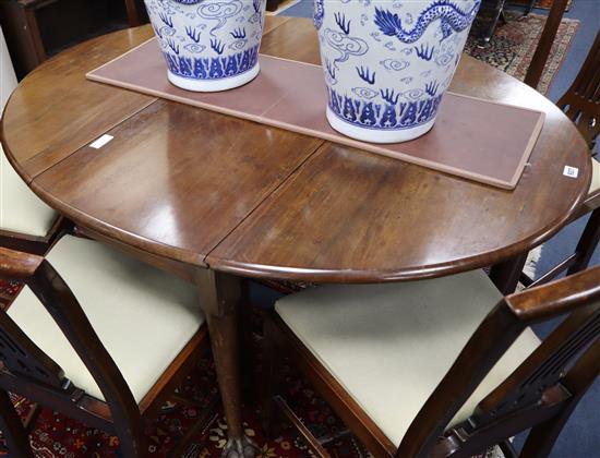 A George III mahogany oval drop leaf dining table 138cm extended